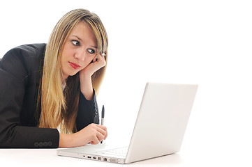 Image showing one young girl work on laptop isolated on white