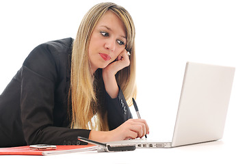 Image showing one young girl work on laptop isolated on white