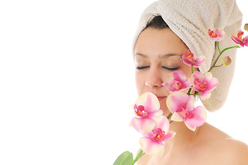 Image showing beautiful young  woman face with flower and towel