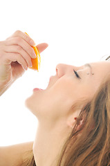 Image showing woman portrait with orange isolated on white 