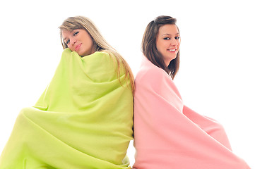 Image showing young girls under blanket smile