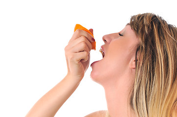 Image showing woman isolated on white hold orange