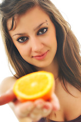 Image showing woman isolated on white hold orange