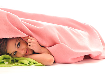 Image showing young girls under blanket smile 