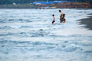 Image showing childs having fun on beach at early morning