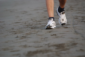 Image showing man walking on beach