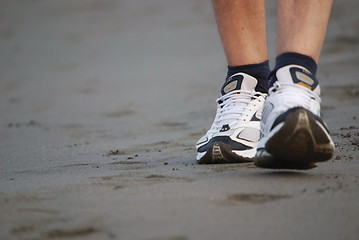 Image showing man walking on beach