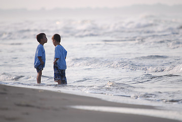 Image showing childs having fun on beach at early morning