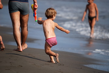 Image showing little girl running at the beach