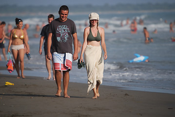 Image showing happy couple walking on beach