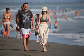 Image showing happy couple walking on beach