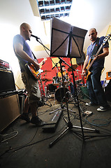 Image showing music band have training in garage