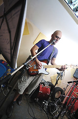 Image showing music band have training in garage