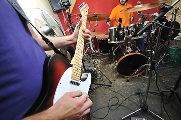 Image showing music band have training in garage