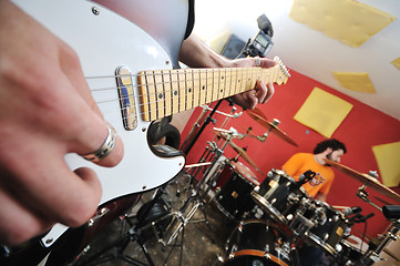 Image showing music band have training in garage