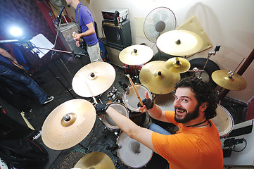 Image showing music band have training in garage