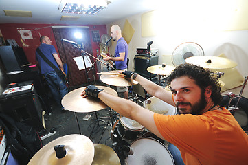 Image showing music band have training in garage