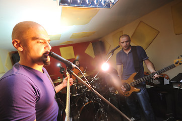 Image showing music band have training in garage