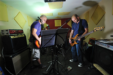 Image showing music band have training in garage