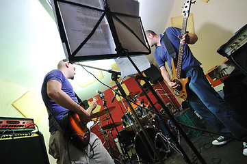 Image showing music band have training in garage