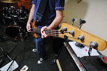 Image showing music band have training in garage