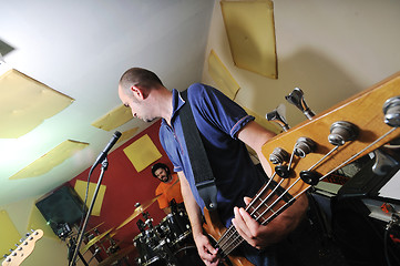 Image showing music band have training in garage