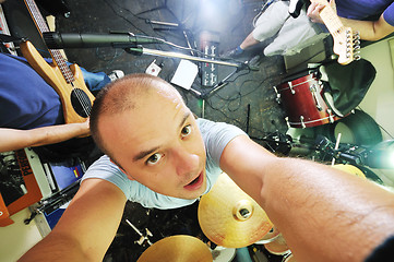 Image showing music band have training in garage