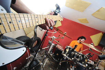 Image showing music band have training in garage