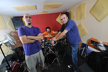 Image showing music band have training in garage