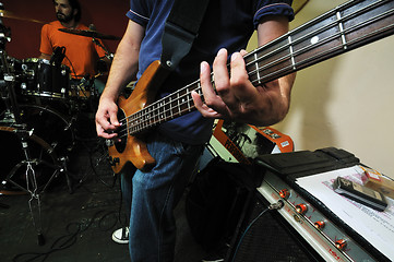 Image showing music band have training in garage