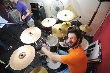 Image showing music band have training in garage