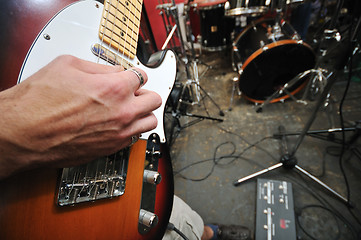 Image showing music band have training in garage