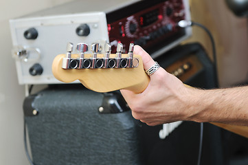 Image showing music band have training in garage