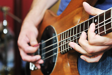 Image showing music band have training in garage