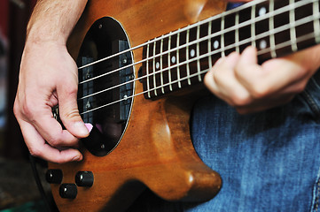 Image showing music band have training in garage