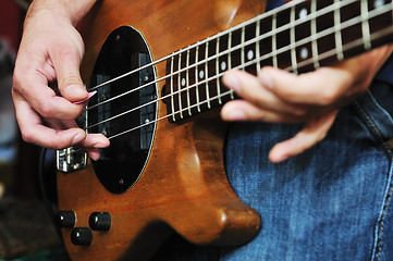 Image showing music band have training in garage