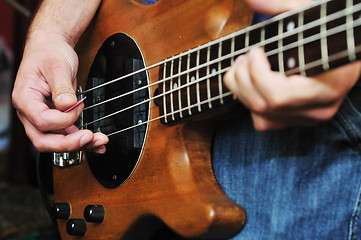 Image showing music band have training in garage