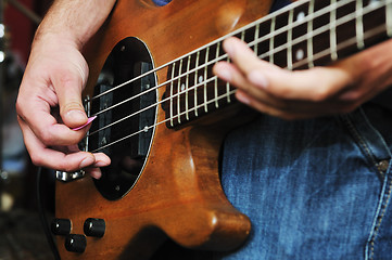 Image showing music band have training in garage