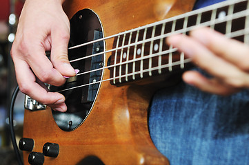 Image showing music band have training in garage