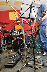 Image showing music band have training in garage