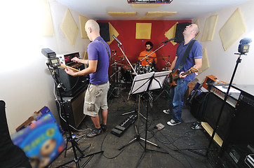 Image showing music band have training in garage