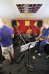 Image showing music band have training in garage