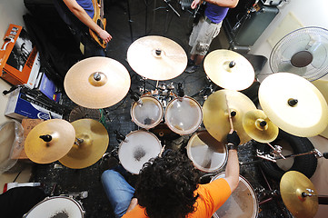 Image showing music band have training in garage