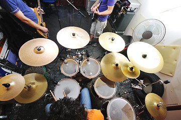 Image showing music band have training in garage