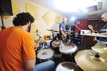 Image showing music band have training in garage