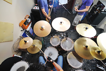 Image showing music band have training in garage