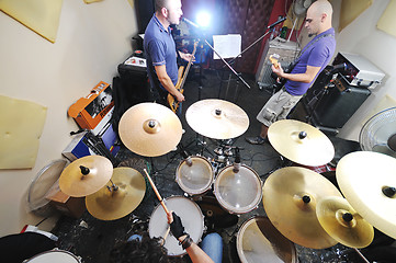 Image showing music band have training in garage