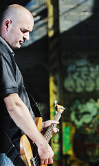 Image showing music guitar player outdoor 