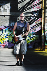 Image showing music guitar player outdoor 