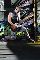 Image showing music guitar player outdoor 